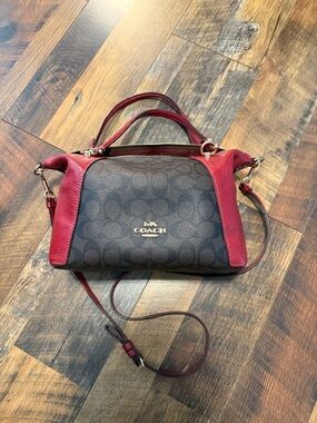 COACH Signature Canvas Satchel with Red Leather Trim.